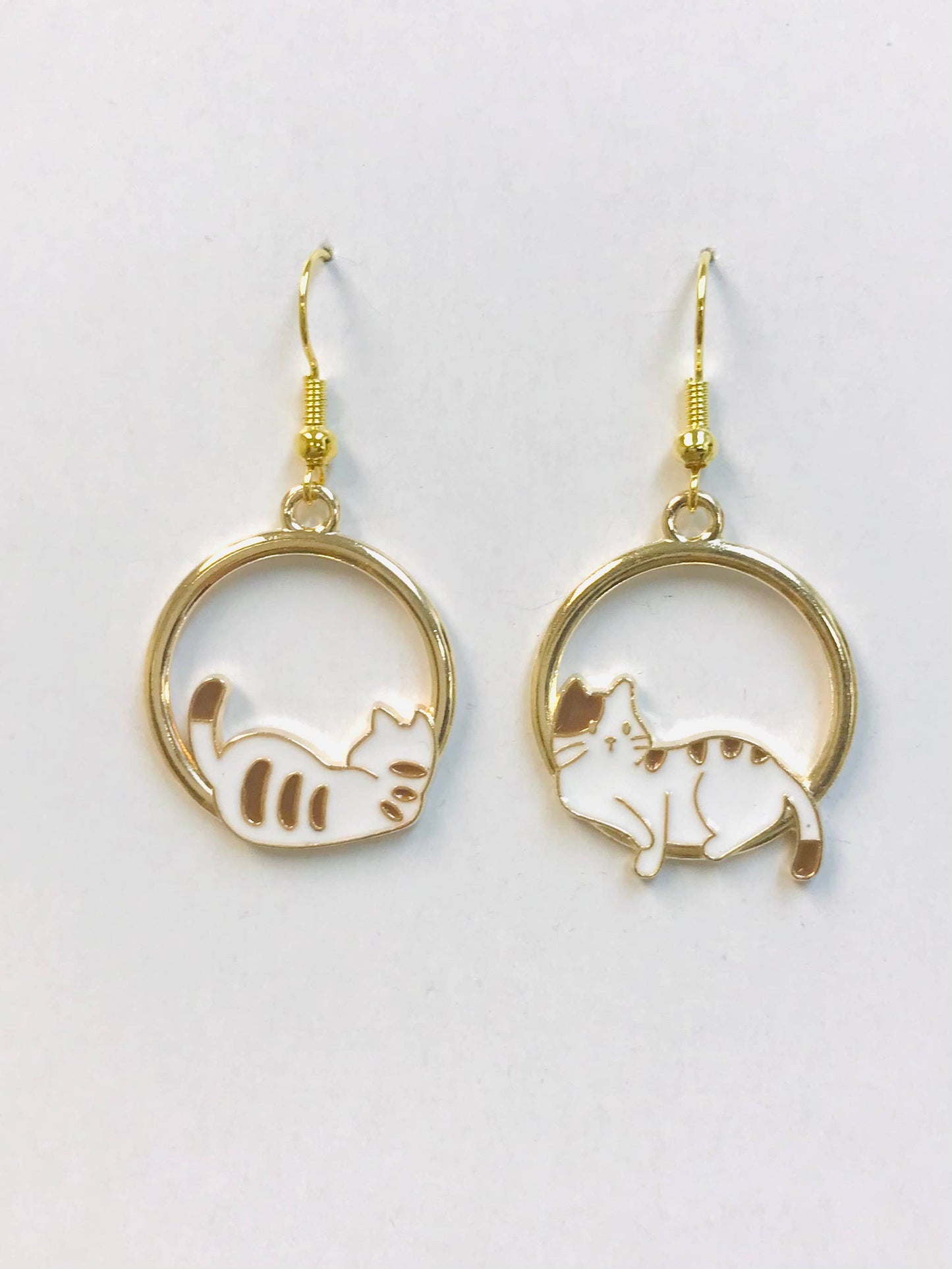 Gold acrylic cat-shaped earrings featuring adorable napping cats, lightweight and perfect for everyday wear